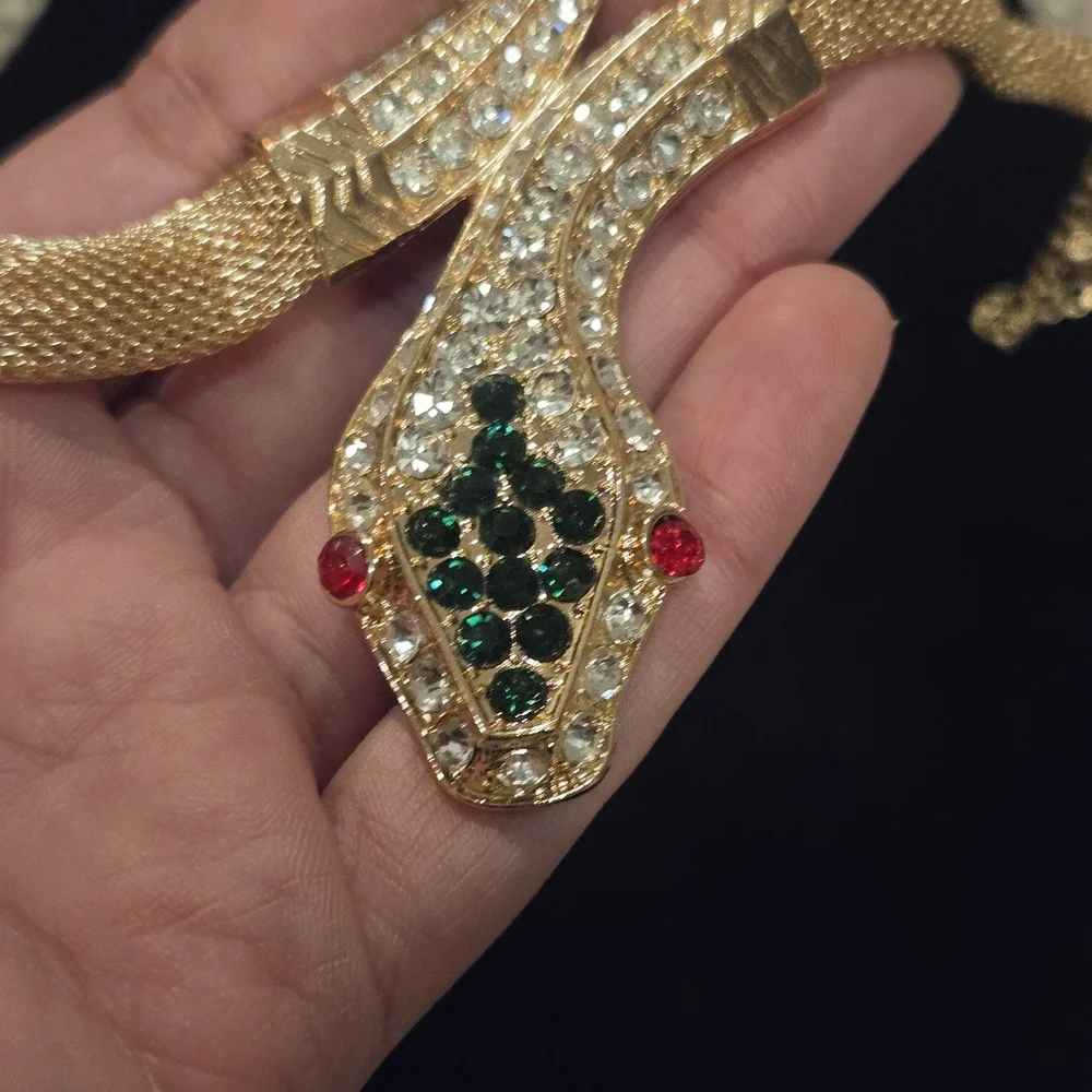 Elegant Gold Snake Bracelet with Green and Red Accents